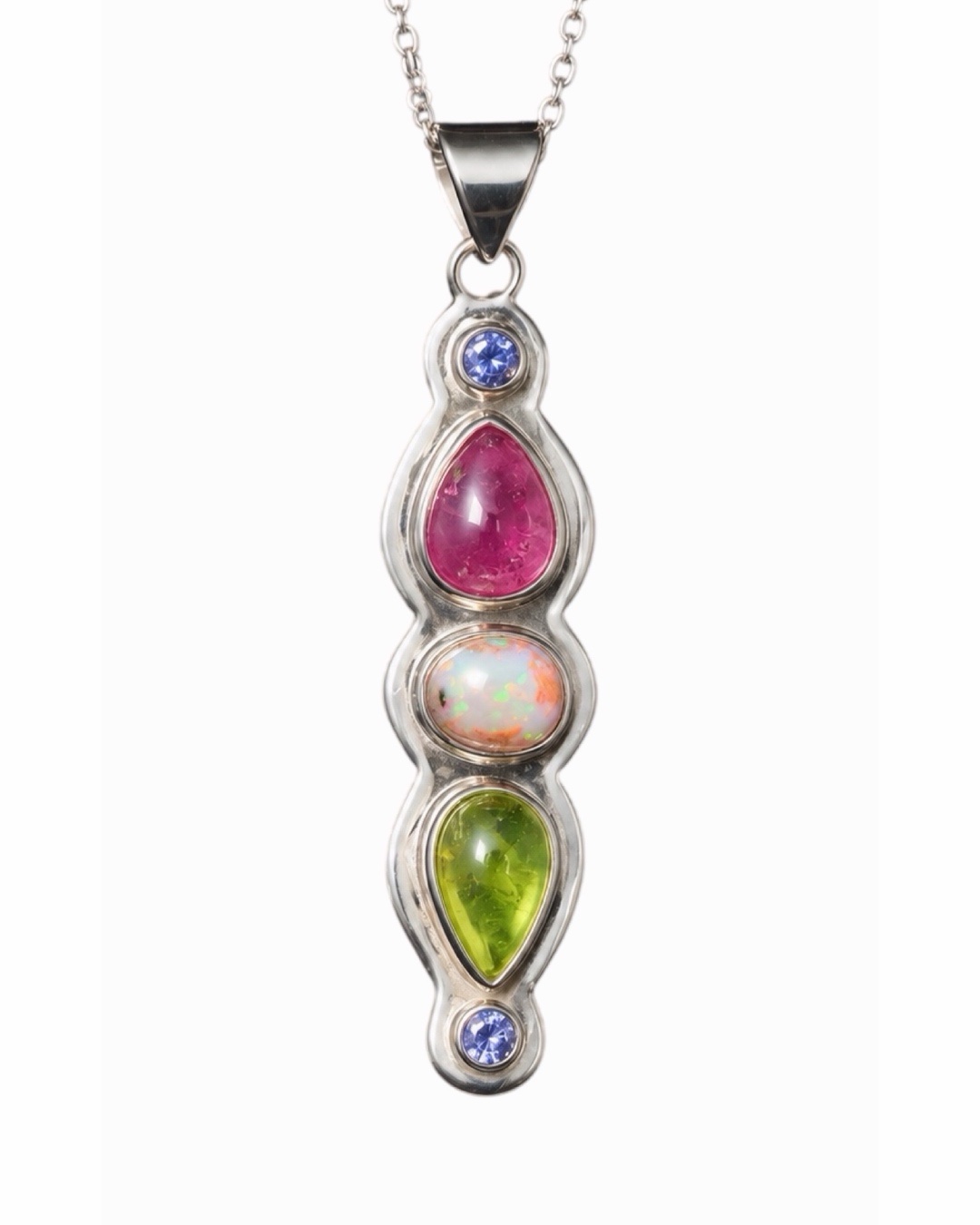 Colgante Diosa Alba. Rubí, ópalo de fuego, peridoto y tanzanitas